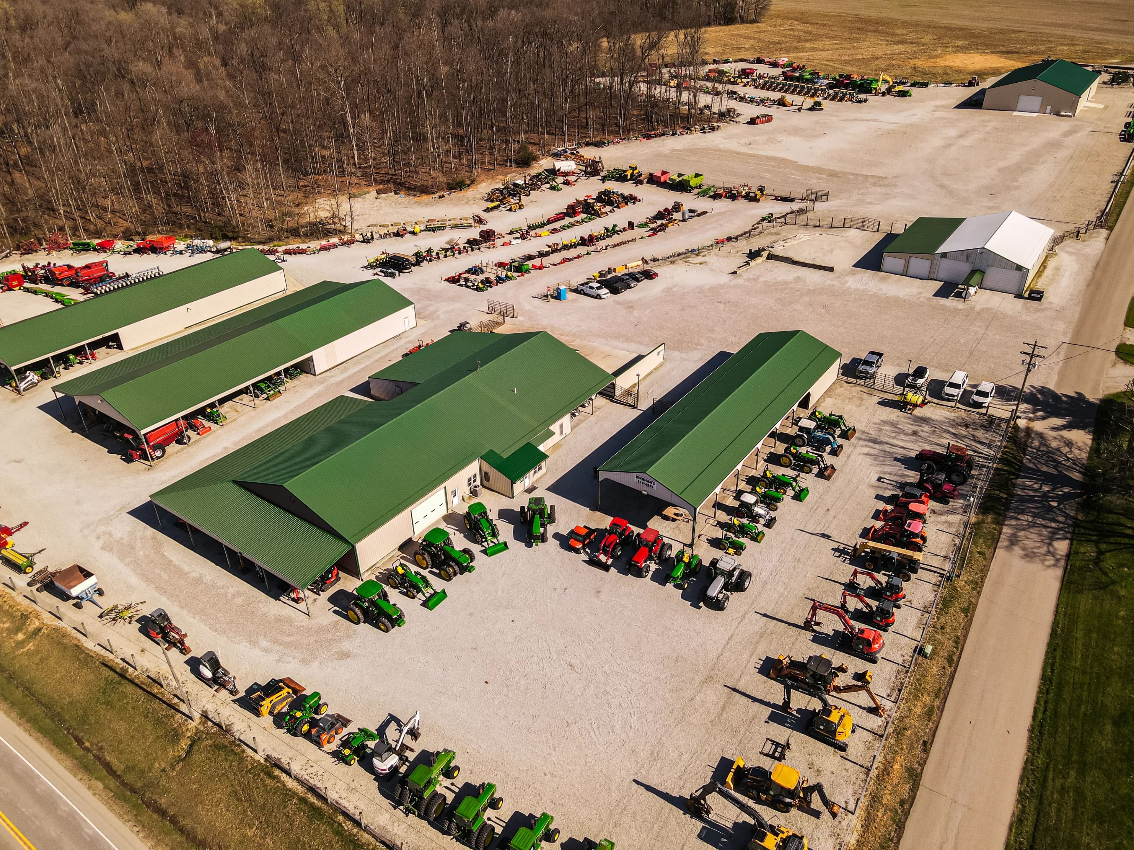 Equipment lined up across the dealership yard